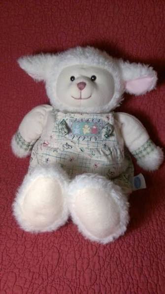 stuffed white lamb in overalls
